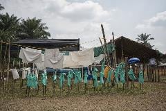 Clothing for health workers is set out to dry at the MSF transit centre in Itipo.
