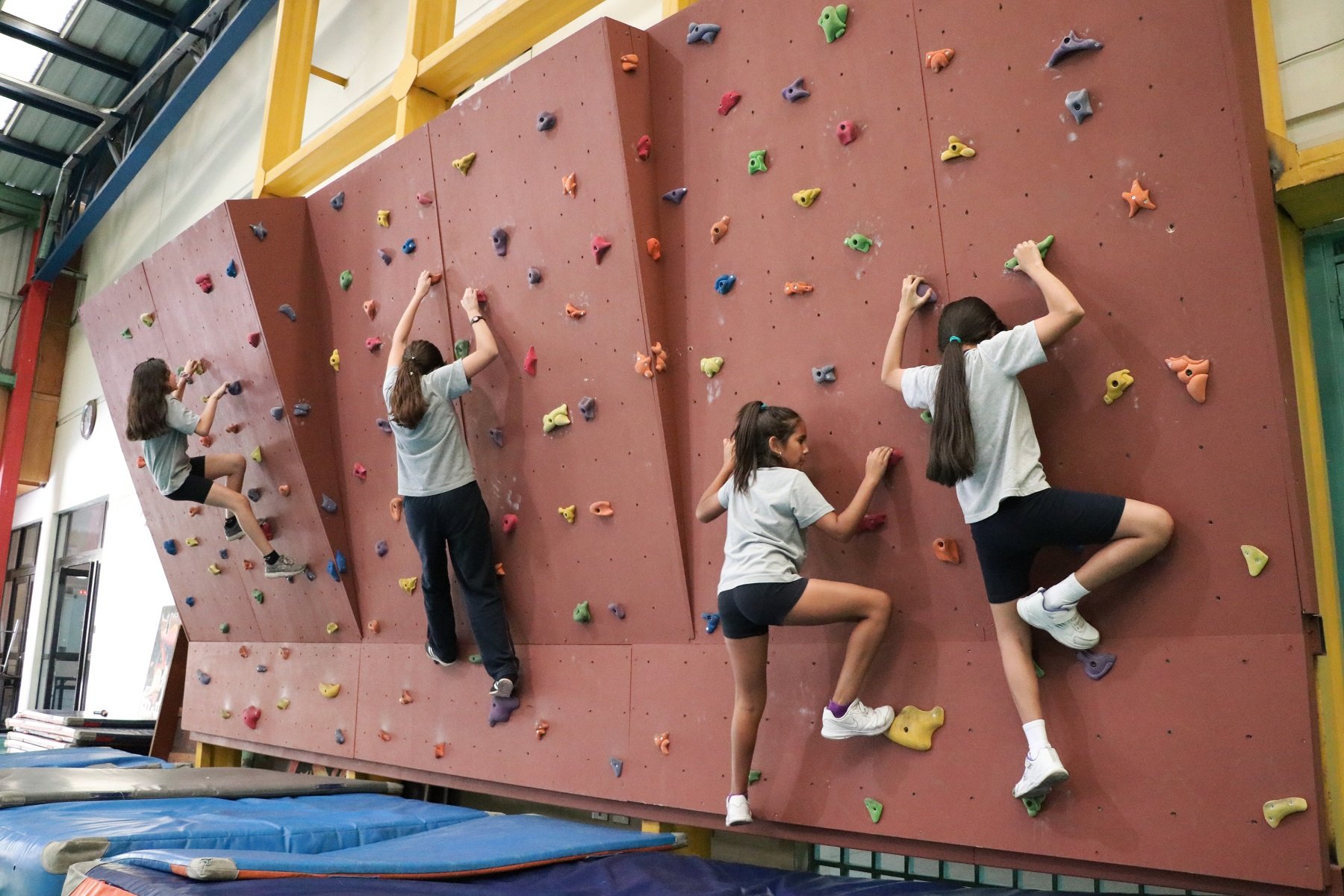 children climing a wall